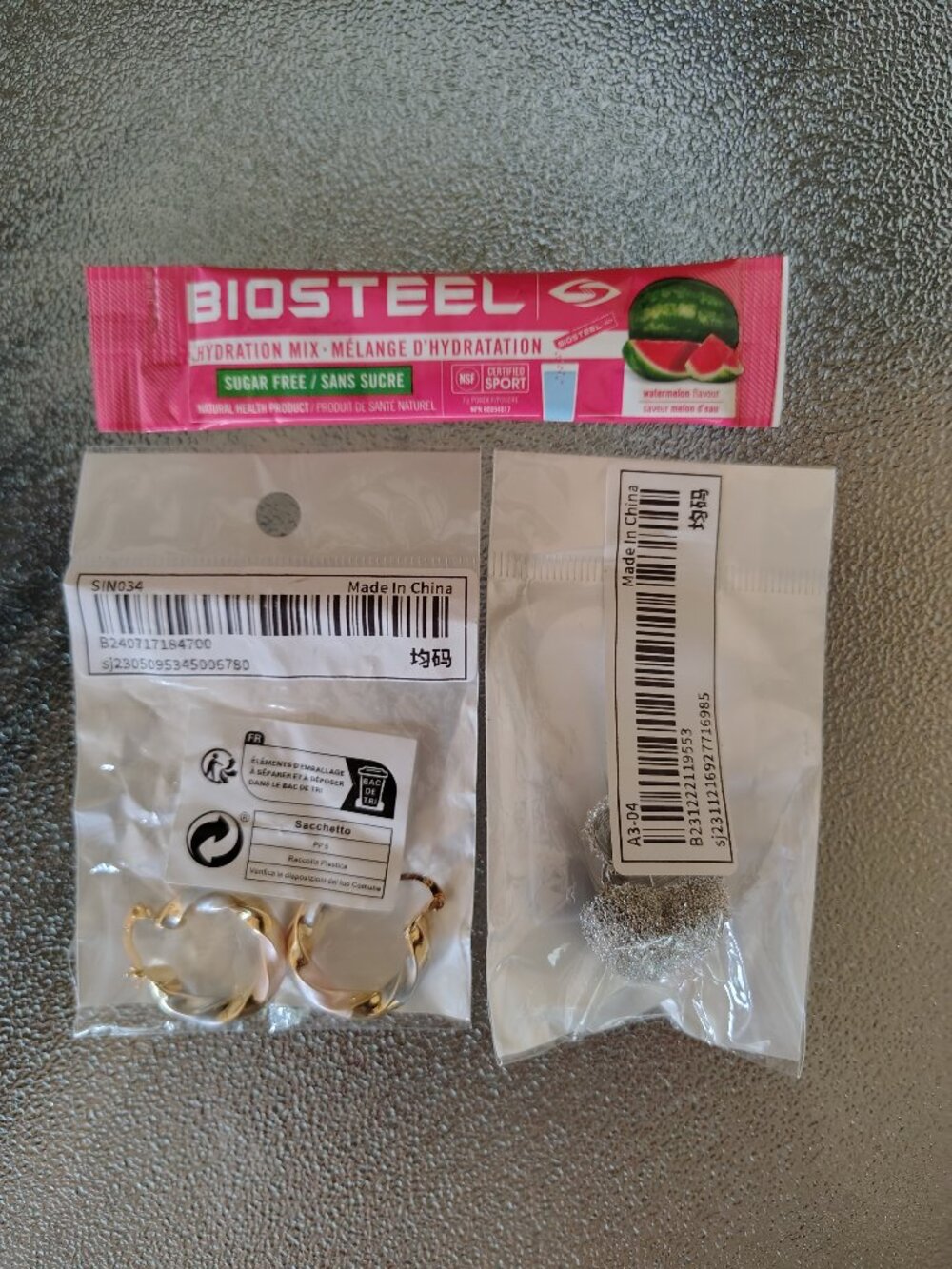 Set of Women's earrings and biosteel sample
